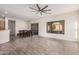 Bright and airy living room with dining area, large windows, and stylish wood-look tile floors at 6915 S Sapphire Way, Chandler, AZ 85249