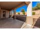 Covered patio overlooking a landscaped backyard with vibrant green shrubbery at 6915 S Sapphire Way, Chandler, AZ 85249