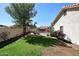 Green backyard with a cozy pool area and mature landscaping, offering a private outdoor retreat at 819 W Harbor Dr, Gilbert, AZ 85233