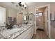 Bathroom with dual sinks, granite countertops and a shower/tub combination at 819 W Harbor Dr, Gilbert, AZ 85233