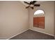 Comfortable bedroom with neutral carpet, light walls, and a wood blind covered window at 819 W Harbor Dr, Gilbert, AZ 85233