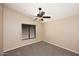 Simple bedroom featuring neutral carpet, light walls, and a single window with blinds at 819 W Harbor Dr, Gilbert, AZ 85233