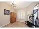 Bright foyer featuring a large window, decorative shutters, and wood-look tile flooring at 819 W Harbor Dr, Gilbert, AZ 85233