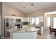 Bright kitchen featuring granite countertops, white cabinets, and stainless steel appliances at 819 W Harbor Dr, Gilbert, AZ 85233