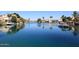 Calm waterfront scene with boats and houses, highlighting the community's serene setting at 819 W Harbor Dr, Gilbert, AZ 85233