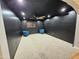 Bedroom featuring black walls, white carpet and a ceiling fan at 8227 N 47Th Dr, Glendale, AZ 85302