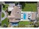 Aerial view of the property showcasing the pool, playground, and lush landscaping at 9114 N 55Th St, Paradise Valley, AZ 85253