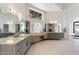 Bright bathroom with dual vanities, a large window, and plenty of storage space at 9114 N 55Th St, Paradise Valley, AZ 85253