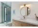 Sleek bathroom featuring modern vanity, stylish mirror, and walk-in glass shower, offering a luxurious feel at 9114 N 55Th St, Paradise Valley, AZ 85253