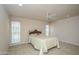 Bedroom features neutral-colored walls, carpeted flooring, and a ceiling fan at 9634 W Glen Oaks N Cir, Sun City, AZ 85351