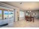 Dining area features a patio view, decorative pendant lighting, and tile flooring at 9634 W Glen Oaks N Cir, Sun City, AZ 85351