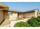 Inviting home entrance with decorative security door and tidy desert landscaping at 9634 W Glen Oaks N Cir, Sun City, AZ 85351