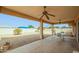 Relaxing covered patio with ceiling fans and an outdoor table, perfect for outdoor dining at 9634 W Glen Oaks N Cir, Sun City, AZ 85351