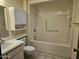 Bathroom showcasing the tiled shower/tub combo, vanity, and toilet at 9847 W Silver Bell Dr, Sun City, AZ 85351