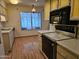 Kitchen featuring linoleum floor, stainless steel appliances and a sunroom view at 9847 W Silver Bell Dr, Sun City, AZ 85351