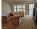 Cozy living room featuring a comfortable sofa, chairs, and natural light from the windows at 9847 W Silver Bell Dr, Sun City, AZ 85351