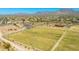 Scenic aerial view showcasing the community park with sports fields, walking trails, and desert landscape with mountain views at 9850 E Mcdowell Mountain Ranch Rd # 1006, Scottsdale, AZ 85260