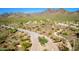 Aerial view of the community entrance with desert landscape and mountain views at 9850 E Mcdowell Mountain Ranch Rd # 1006, Scottsdale, AZ 85260