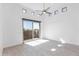 Bright and airy living room with tile floors, a ceiling fan and access to outdoor area at 9850 E Mcdowell Mountain Ranch Rd # 1006, Scottsdale, AZ 85260