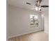 Bedroom featuring wood-look floors and natural light at 10135 W Orange Dr, Glendale, AZ 85307