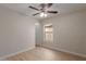 Bedroom featuring wood-look floors, closet, and ceiling fan at 10135 W Orange Dr, Glendale, AZ 85307