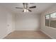 Bedroom featuring wood-look floors, ceiling fan and a closet at 10135 W Orange Dr, Glendale, AZ 85307