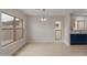 Dining room with new floors, neutral walls, modern light fixture, and backyard view at 10135 W Orange Dr, Glendale, AZ 85307