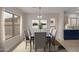 Elegant dining room with ample natural light, stylish decor, and easy access to the kitchen at 10135 W Orange Dr, Glendale, AZ 85307