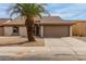 Charming single-story home with desert landscaping and a mature palm tree in the front yard at 10135 W Orange Dr, Glendale, AZ 85307