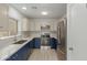Updated kitchen with stainless steel appliances, modern backsplash, and ample counter space at 10135 W Orange Dr, Glendale, AZ 85307