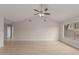 Spacious living room featuring vaulted ceilings, new floors, ample space, and natural light at 10135 W Orange Dr, Glendale, AZ 85307