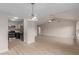 Open living space with stainless steel appliances, updated kitchen, and modern light fixtures at 10135 W Orange Dr, Glendale, AZ 85307
