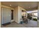 Cozy front porch with a seating area and welcome mat at 10164 W Potter Dr, Peoria, AZ 85382