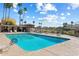 Resort-style community pool with seating and a covered area for residents to enjoy at 10538 E Gold Dust Cir, Scottsdale, AZ 85258