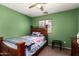 Bedroom with green walls, a window, and a bed at 10922 E Wallflower Ln, Florence, AZ 85132