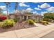 Beautiful single-story home with desert landscaping, including colorful plants and gravel accents at 11133 N 120Th Pl, Scottsdale, AZ 85259