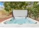 Relaxing hot tub with a cover and clear water amidst a lush backyard setting at 11133 N 120Th Pl, Scottsdale, AZ 85259