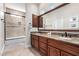 Bathroom featuring a double vanity and a large mirror at 12113 E Laurel Ln, Scottsdale, AZ 85259