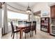 Dining area with floor to ceiling windows and backyard pool view at 12113 E Laurel Ln, Scottsdale, AZ 85259