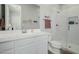 Bright bathroom featuring a white vanity, shower, and toilet at 1265 E La Fortuna Ct, San Tan Valley, AZ 85140