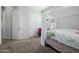 Cozy bedroom featuring plush carpet and a partially visible canopy bed at 1265 E La Fortuna Ct, San Tan Valley, AZ 85140
