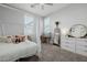 Comfortable bedroom with a writing desk, canopy bed, and a bright, relaxing atmosphere at 1265 E La Fortuna Ct, San Tan Valley, AZ 85140