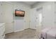 Bright bedroom with hardwood floors and wall-mounted TV at 1265 E La Fortuna Ct, San Tan Valley, AZ 85140
