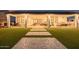 Spacious covered patio featuring outdoor dining area, lounge seating, and access to the landscaped backyard at 1265 E La Fortuna Ct, San Tan Valley, AZ 85140