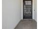 Modern front entryway featuring a decorative screen door and clean architectural lines at 1265 E La Fortuna Ct, San Tan Valley, AZ 85140