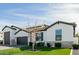 Charming single-story home with well-manicured lawn, stone accents, and neutral color scheme at 1265 E La Fortuna Ct, San Tan Valley, AZ 85140