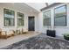 Welcoming front porch with cozy seating, charming decor, and a sleek, modern aesthetic at 1265 E La Fortuna Ct, San Tan Valley, AZ 85140