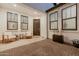 Inviting front porch with comfortable seating, decorative accents, and a stylish brick pathway at 1265 E La Fortuna Ct, San Tan Valley, AZ 85140