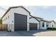 Spacious three-car garage with modern doors and sleek exterior at 1265 E La Fortuna Ct, San Tan Valley, AZ 85140
