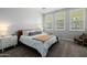 Bright main bedroom featuring carpet floors, natural light, and neutral decor at 1265 E La Fortuna Ct, San Tan Valley, AZ 85140